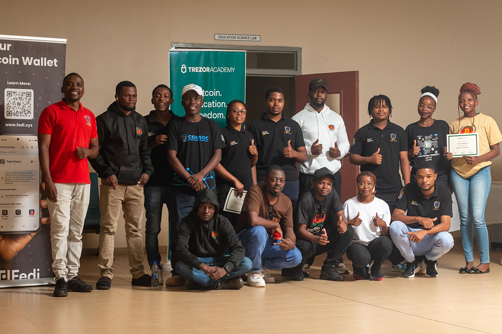 Bitcoin Boma participants receiving Trezor hardware wallets and certificates at UNIMA Bitcoin Education Program March 2026