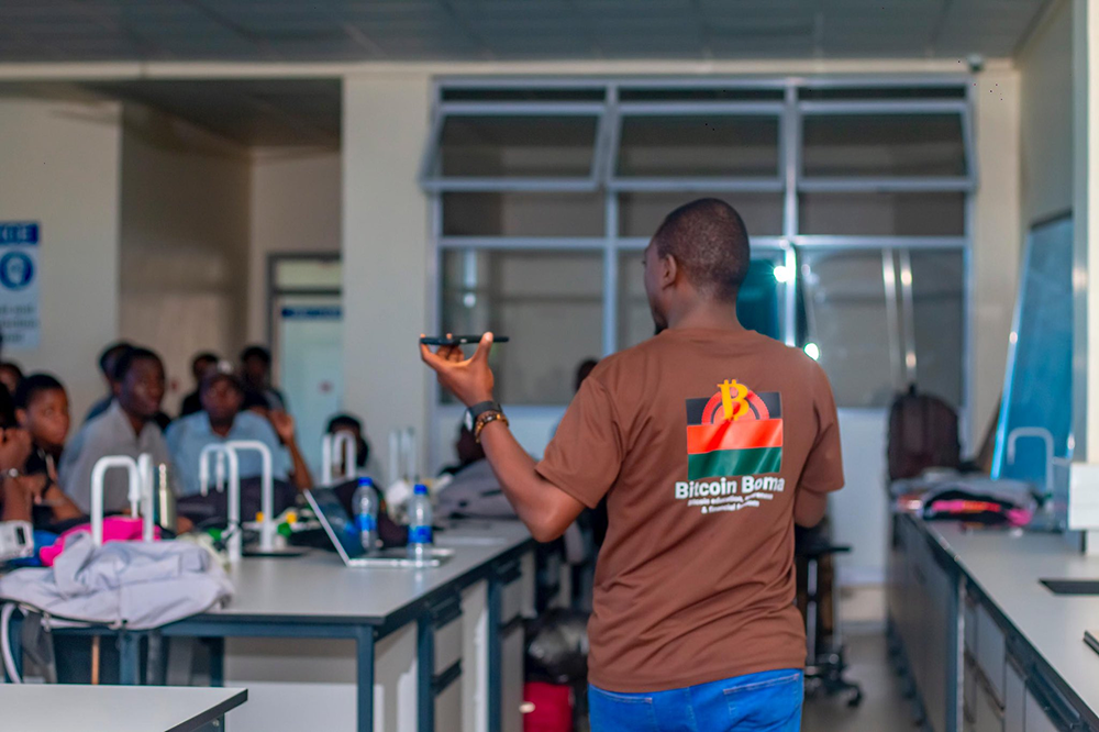 Bitcoin Boma participants receiving Trezor hardware wallets and certificates at UNIMA Bitcoin Education Program March 2026