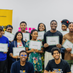 Trezor Academy graduates in Mauritius holding completion certificates after Bitcoin education sessions.